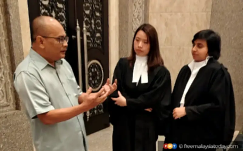 Bekas jurugambar akhbar menang rayuan atas catatan dalam talian terhadap polis