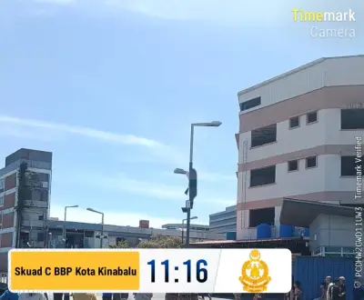 Anggota Bomba Selamatkan Lelaki Terperangkap di Tiang Lampu Jalan di Kota Kinabalu